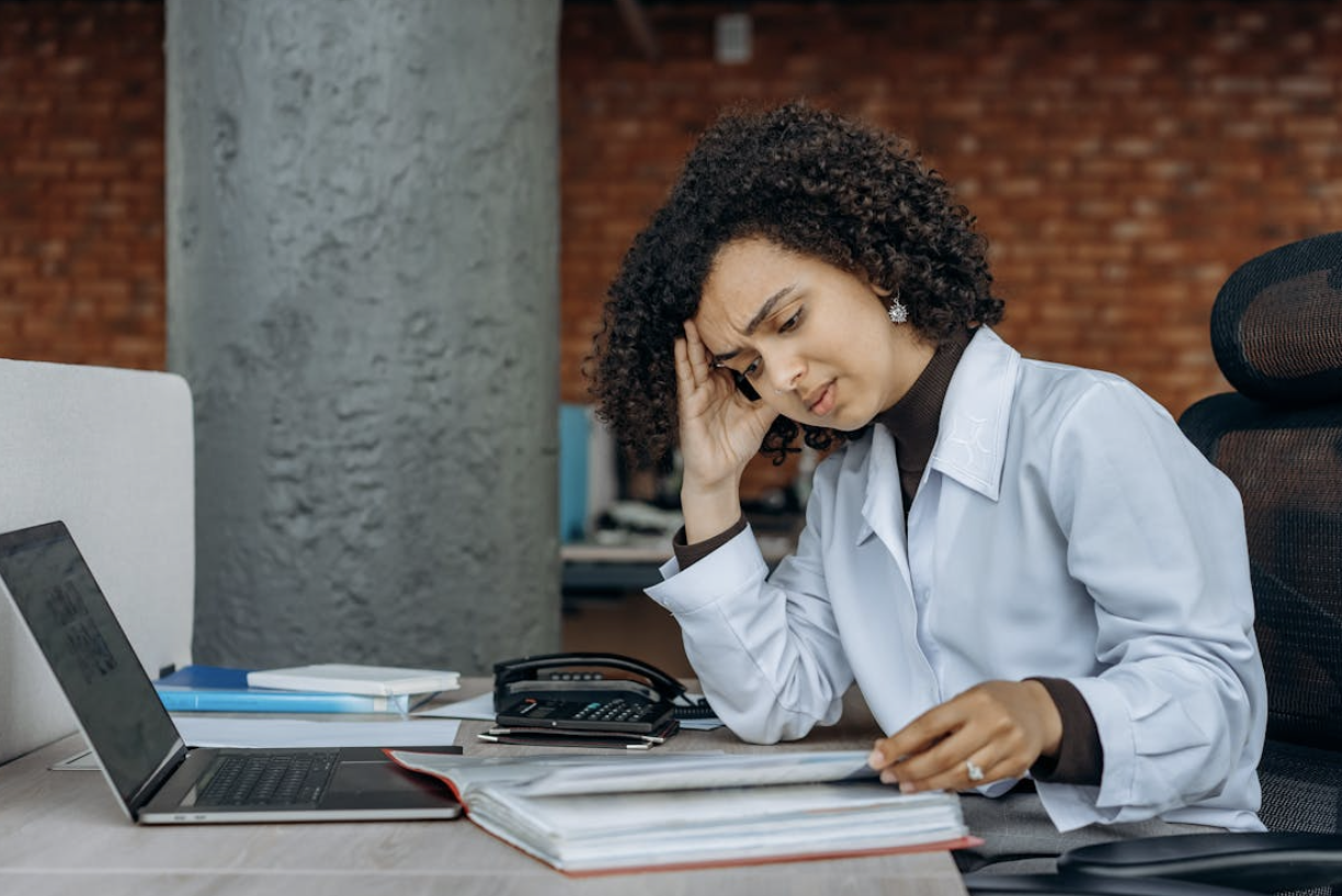 Frustrated Woman Looking at Her Business Finances